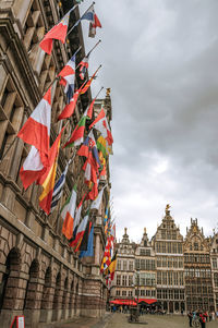 City hall and old buildings at square in antwerp. a multicultural city with huge port in belgium.