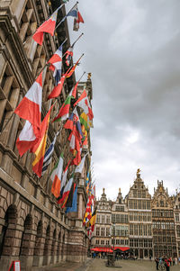 City hall and old buildings at square in antwerp. a multicultural city with huge port in belgium.