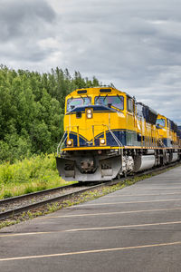 Train on railroad track against sky