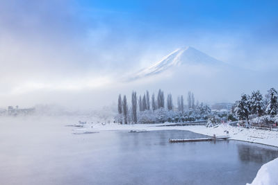 Scenic view of frozen lake against sky