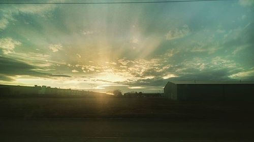 Scenic view of landscape against cloudy sky