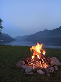 Bonfire on field against sky
