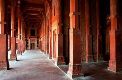 Corridor by architectural columns at jama masjid