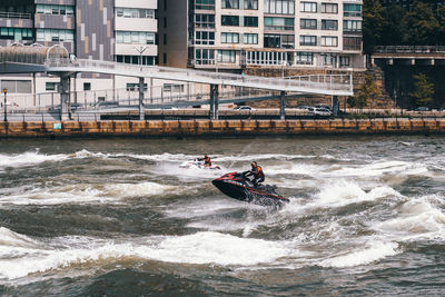 Men in boat on river