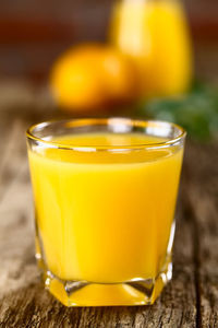 Close-up of yellow drink on table