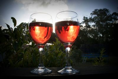 Close-up of red wine on glass