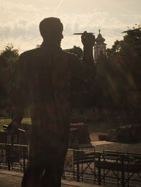 Silhouette of man against sky