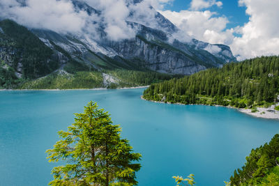 Scenic view of lake and mountains against sky