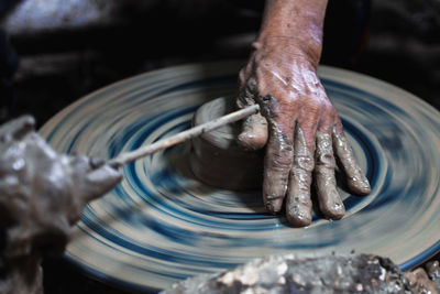 Man working on pottery wheel