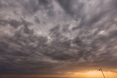 Low angle view of cloudy sky during sunset