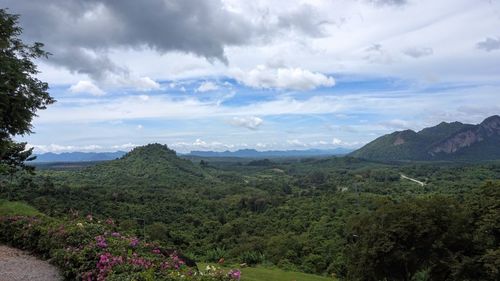 Scenic view of mountains against cloudy sky