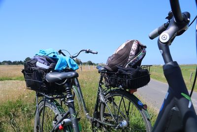 Bicycles on cart against sky