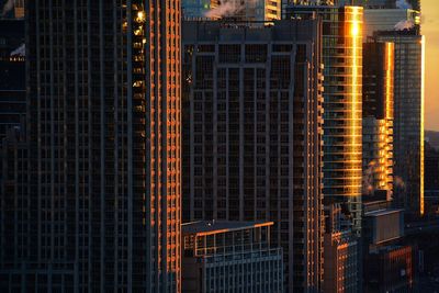 Low angle view of illuminated buildings in city at night