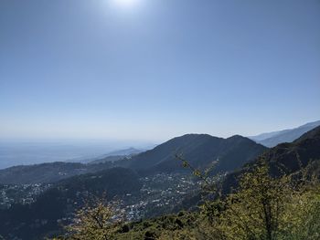 Scenic view of mountains against clear blue sky