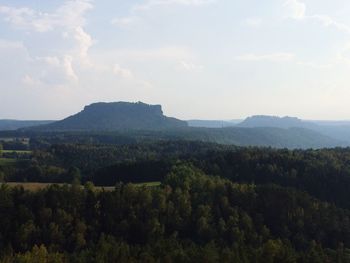 Scenic view of mountains against cloudy sky