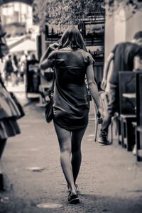 Rear view of woman standing in park