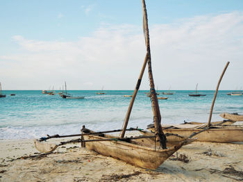 Boat on beach against sky