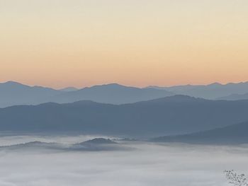 Scenic view of mountains against sky during sunset