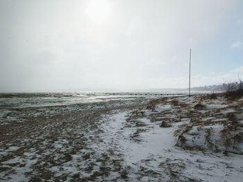 Scenic view of frozen sea against sky