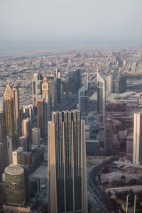 High angle view of modern buildings in city against sky