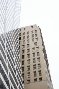 Low angle view of office building against sky