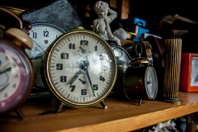 Close-up of clock on table