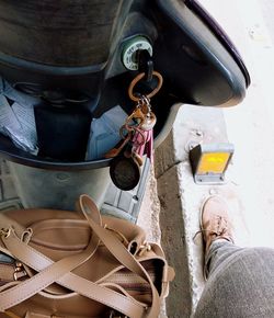 Low section of man standing by car