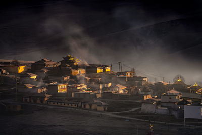 Illuminated buildings in city at night