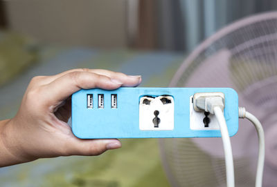 Close-up of hand holding smart phone