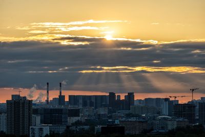 Cityscape against sky during sunset