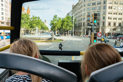 Rear view of woman in bus