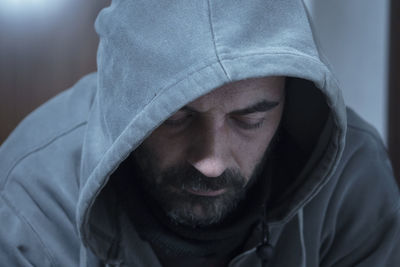 Close-up of man wearing hooded shirt