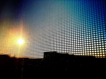 Chainlink fence at sunset