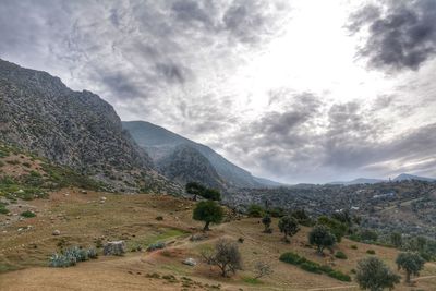 Scenic view of landscape and mountains against sky