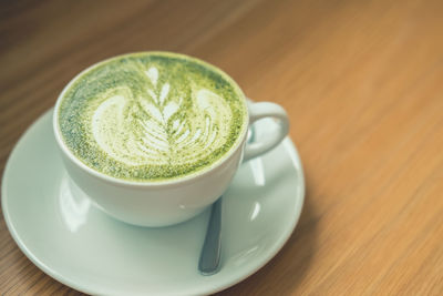 Close-up of coffee cup on table