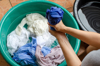 High angle view of woman washing clothes