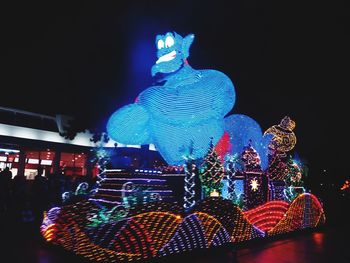 Low angle view of illuminated lights at night