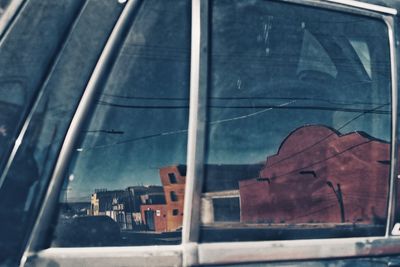 Reflection of building on glass window