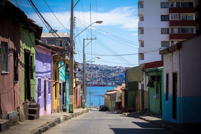 Street amidst cityscape against sky