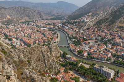High angle view of townscape and mountains in town