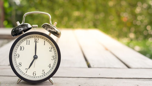 Close-up of clock on table