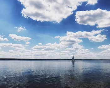 Scenic view of sea against cloudy sky