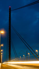 Light trails on suspension bridge at night