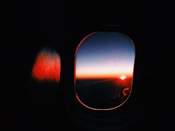 Close-up of illuminated lights at sunset