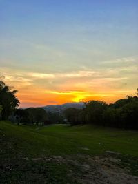 Scenic view of landscape against sky during sunset