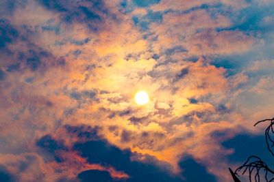 Low angle view of dramatic sky during sunset