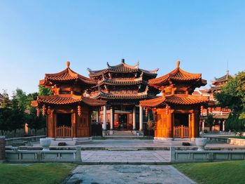 Temple outside building against clear sky