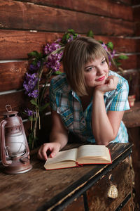 Thoughtful woman leaning at table