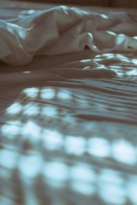 Close-up of woman lying on bed