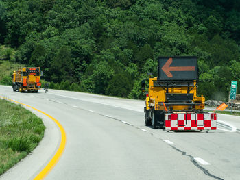 View of truck on road against trees